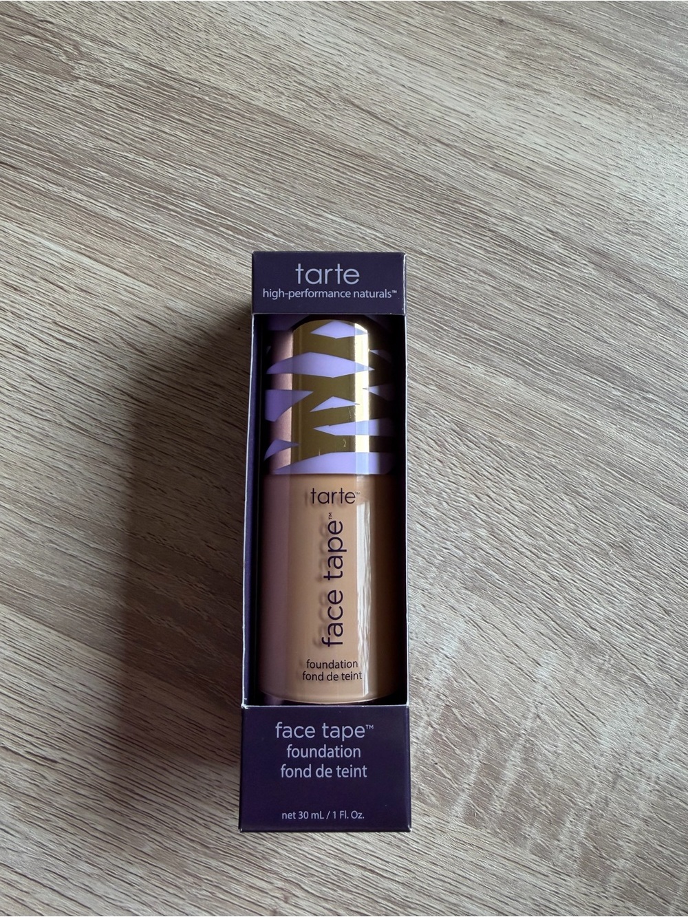 tarte Face Tape Foundation — beige with purple and gold cap accents